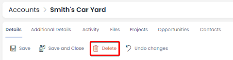 A screenshot of the &quot;Delete&quot; button on an item page. The button has an icon of a red trash can, and a red label that reads &quot;Delete&quot;. The screenshot is annotated with a red box that highlights the location of the Delete button in the item page Command Bar.